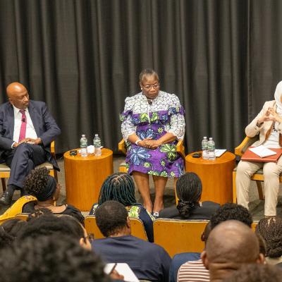A panel of 5 people in Luce Hall Auditorium
